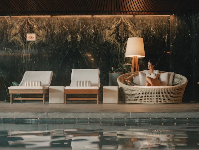 woman sitting by the pool